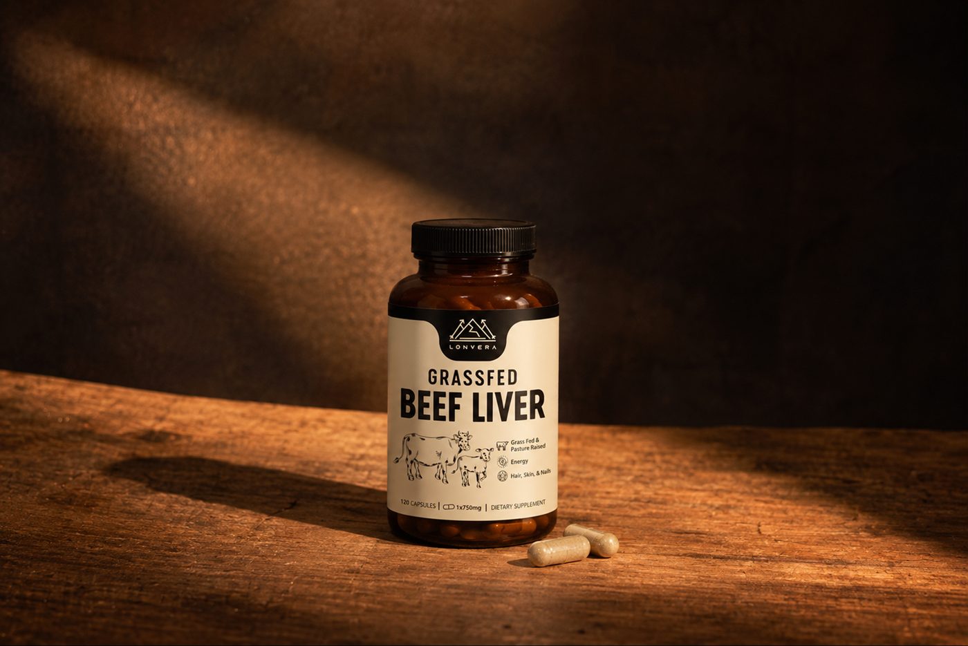 Grassfed Beef Liver bottle and capsules on a dark wooden table in warm light